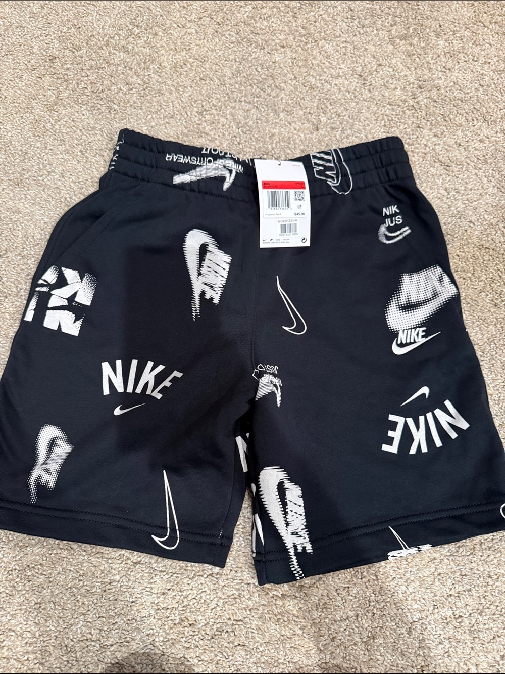 Nike Black Shorts with White Swoosh Graphic